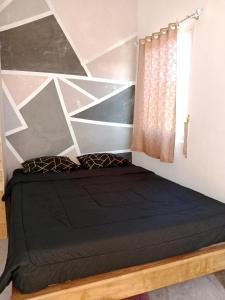 Anggie Homestay客房内的一张或多张床位