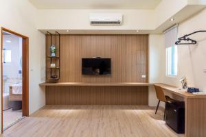 Μια τηλεόραση ή/και κέντρο ψυχαγωγίας στο KUN INN Tie Hua