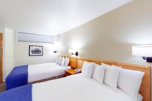 Ένα ή περισσότερα κρεβάτια σε δωμάτιο στο Aspen Mountain Lodge