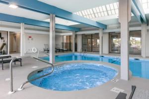 a large pool with a hot tub in a building at Bluewater Vacation Rentals in Orange Beach +243 photos