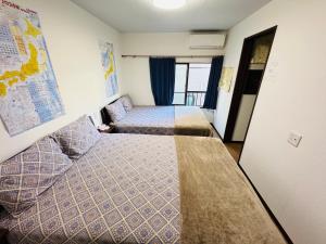 Postel nebo postele na pokoji v ubytování 大阪枫晴102