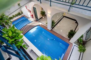 an overhead view of a swimming pool in a house with plants at Jan Villa SaiGon Oasis in Ho Chi Minh City