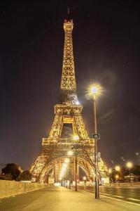 a view of the eiffel tower at night at Paris Rooms -Rynek Centrum -F VAT in Kielce