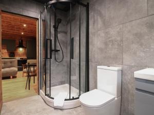 a bathroom with a shower and a toilet at Badger's Burrow in Oakham +49 photos