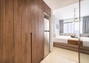 a bedroom with a bed and a large window at Apartment at Al Zahia - The Pearl in Ḩiz̧āyib az Zānah +22 photos