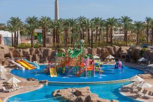 a pool with a water park with a water slide at Reef Oasis Beach Aqua Park Resort in Sharm El Sheikh
