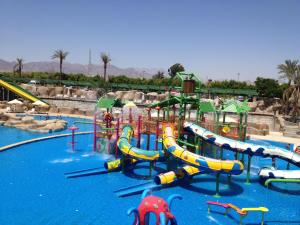 a water park with a bunch of water slides at Reef Oasis Beach Aqua Park Resort in Sharm El Sheikh