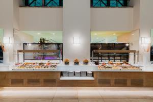 a bakery with many different types of food on display at Reef Oasis Beach Aqua Park Resort in Sharm El Sheikh