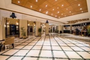 a lobby of a hotel with a tile floor at Reef Oasis Beach Aqua Park Resort in Sharm El Sheikh +289 photos