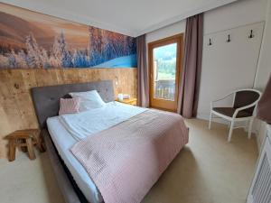 Postelja oz. postelje v sobi nastanitve Gästehaus Kaiserblick