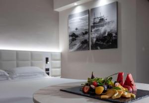 a tray of fruit on a table in a bedroom at Hotel Cristallo in Giulianova