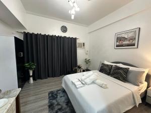 Ένα ή περισσότερα κρεβάτια σε δωμάτιο στο Davao City Studio Unit Condo near airport +2 φωτογραφίες