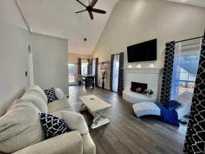 a living room with a couch and a fireplace at Lake Lanier House 1 in Gainesville