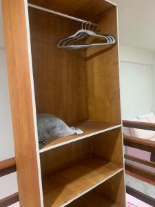 En eller flere senge i et værelse på Residencial Estrela Guia 1