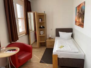 Postel nebo postele na pokoji v ubytování Hotel Am Hopfenmarkt