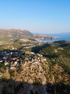 an aerial view of a village on a mountain at Ionian Terrace in Himare +26 photos