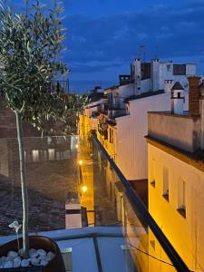 a view of a city at night from a balcony at Mamma Mia Hotel Boutique - Only Adults in Tossa de Mar