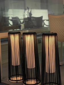 two black and white candles sitting on a table at Mamma Mia Hotel Boutique - Only Adults in Tossa de Mar
