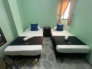 Postel nebo postele na pokoji v ubytování Hotel El Bosque
