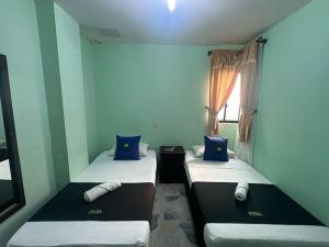 Postel nebo postele na pokoji v ubytování Hotel El Bosque