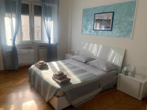 Postel nebo postele na pokoji v ubytování SoleMare Rooms Trieste