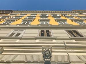 a building with a lion on the side of it at Italy Vacation Rental in Trieste