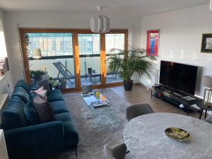 a living room with a couch and a table at Fred Appartement Lille Centre in Lille