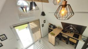 an overhead view of a room with a desk and lights at Lampion Vendégház in Szigetvár