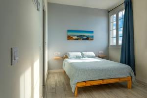 Postel nebo postele na pokoji v ubytování Tierritas Village (Ventanas del Atlántico 2)