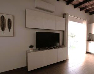 TV a/nebo společenská místnost v ubytování Casa Ita