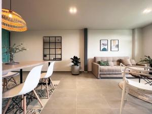 a living room with a couch and a table at Parallelo loft Salento P5 in Salento