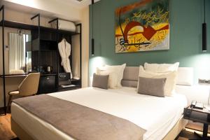 Voodi või voodid majutusasutuse NJ Hotel Rabat toas