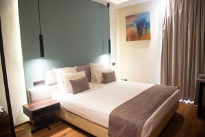 Voodi või voodid majutusasutuse NJ Hotel Rabat toas