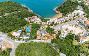 an aerial view of a resort next to the ocean at Casa Ceiba Huatulco - Adults Only in Santa Cruz Huatulco +58 photos