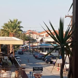 a city street with cars parked in a parking lot at Πολυτελης διαμέρισμα in Ierissos +16 photos
