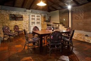 a dining room with a wooden table and chairs at Villa Goga in Vela Luka
