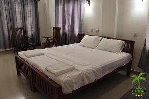 CHAEL Airport Residency,Nedumbassery Cochin客房内的一张或多张床位