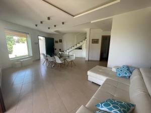a large living room with a couch and a table at Villa Anzio in Anzio