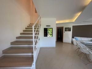 a staircase in a house with a living room at Villa Anzio in Anzio +13 photos
