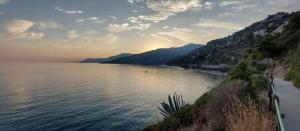a view of a body of water with mountains at Casa vacanze Paglino in Ventimiglia