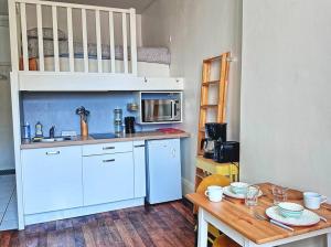 Køkken eller tekøkken på Studio central et confortable