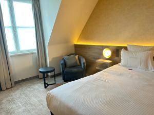 Postel nebo postele na pokoji v ubytování Hotel Restaurant Weinebrugge