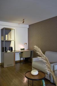 a living room with a couch and a table at Hôtel RALF in Alger