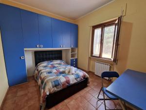 a bedroom with a bed with a dog laying on it at Vista Mare House in Fiumicino