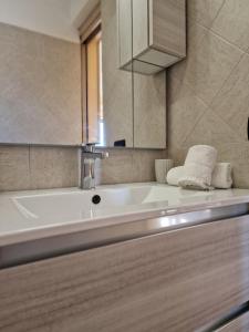 a bathroom with a white tub and a mirror at Vista Mare House in Fiumicino +47 photos