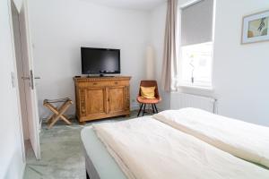 TV a/nebo společenská místnost v ubytování Ferienhaus Kleiner Kaiser