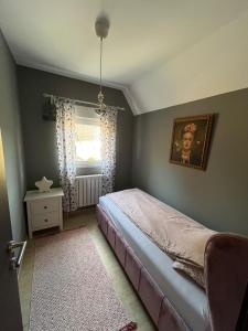 Postel nebo postele na pokoji v ubytování Apartman Jana 2