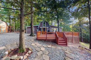 a small house with a fence and a tree at View for Two in Ellijay