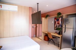 Cozzy Suites Paraíso Hotel客房内的一张或多张床位