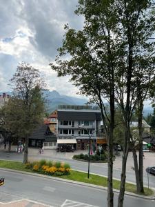 a street in a town with a building at Yeti Apartamenty Krupówki 73C in Zakopane